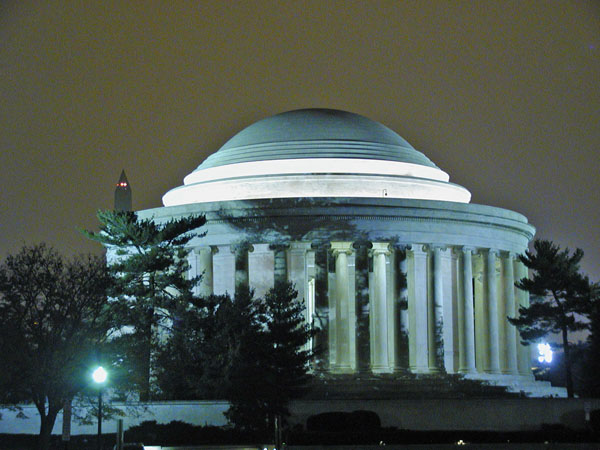 Jefferson Memorial at night with Washington Monument behind it